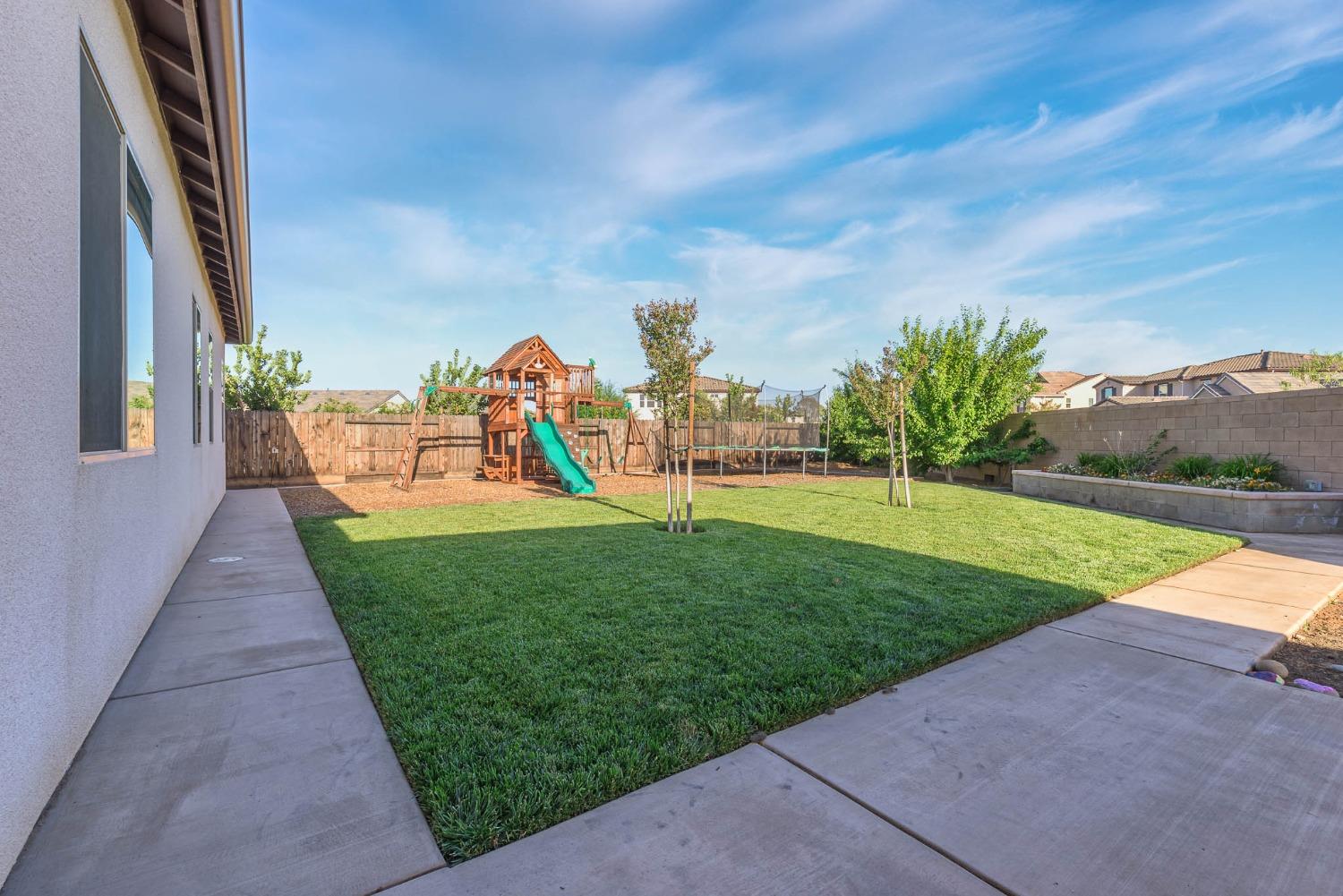 3230 Enterprise Avenue Clovis, CA 93619 - Photo 31 of 41 a view of a garden with a lake