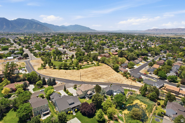 1263 East 1200th South Springville, UT 84663 - Photo 57 of 60 Expansive aerial view showcasing a developed residential neighborhood with distant mountain ranges