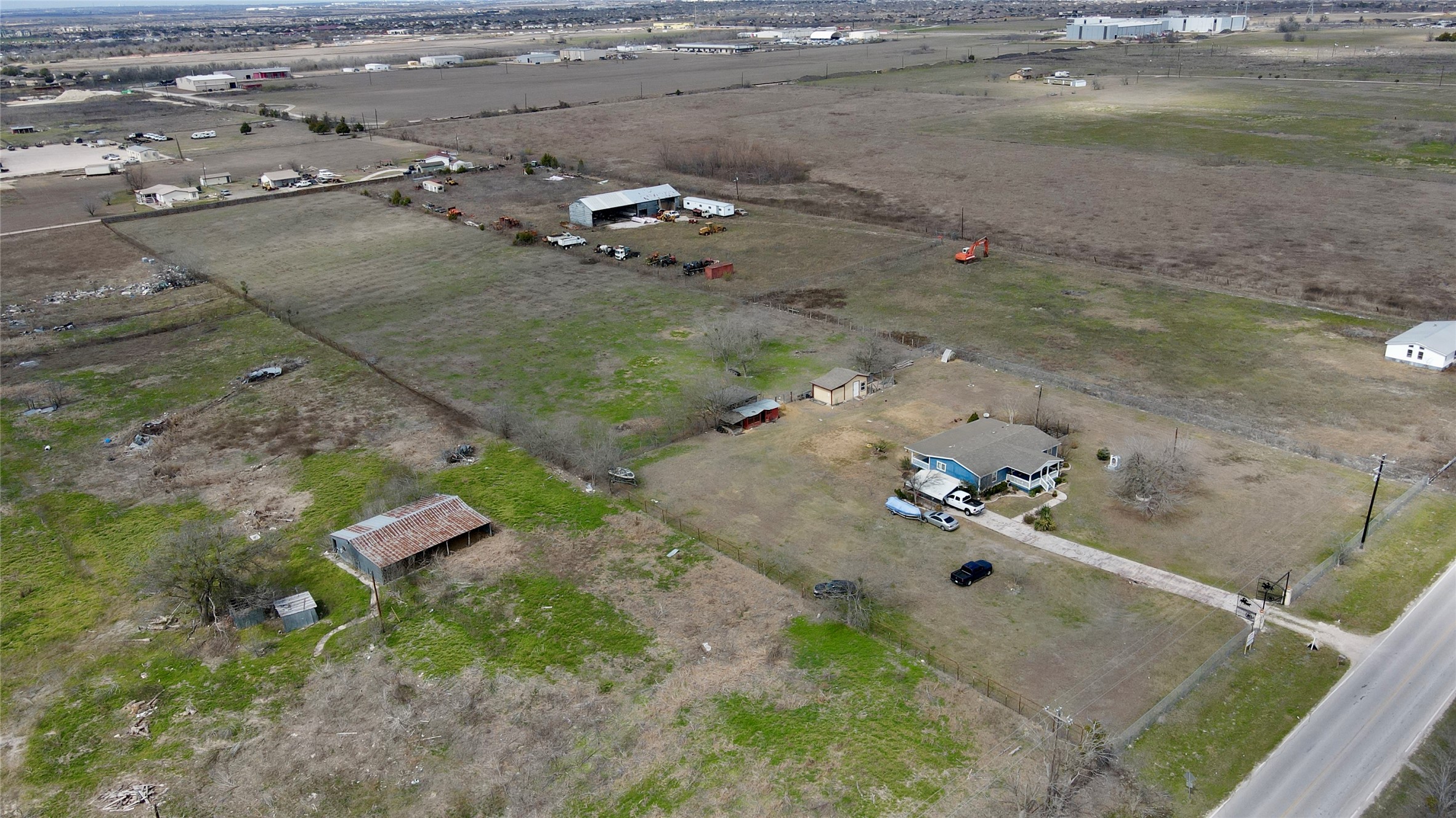 12322 Old Kimbro Road Manor, TX 78653 - Photo 7 of 18 an aerial view of a house with a yard