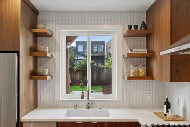 a view of kitchen island with stainless steel appliances