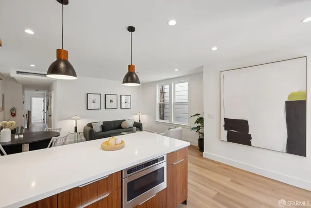 a bedroom with a balcony a bed and a large window