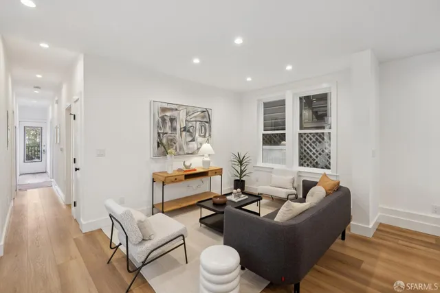 a kitchen with stainless steel appliances granite countertop a sink and a refrigerator