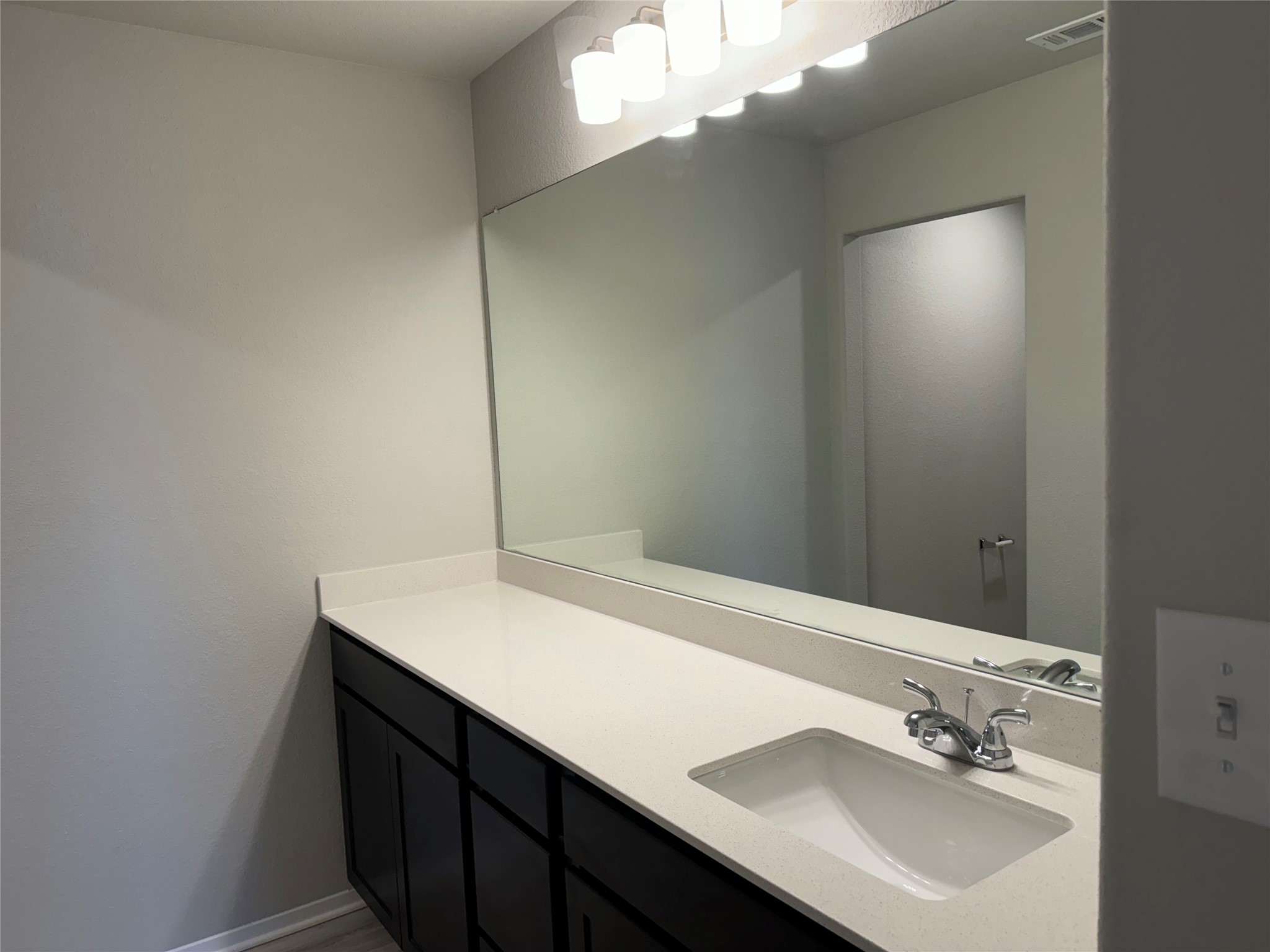 151 Bent Crk Lane Georgetown, TX 78628 - Photo 13 of 17 a bathroom with a sink and a mirror