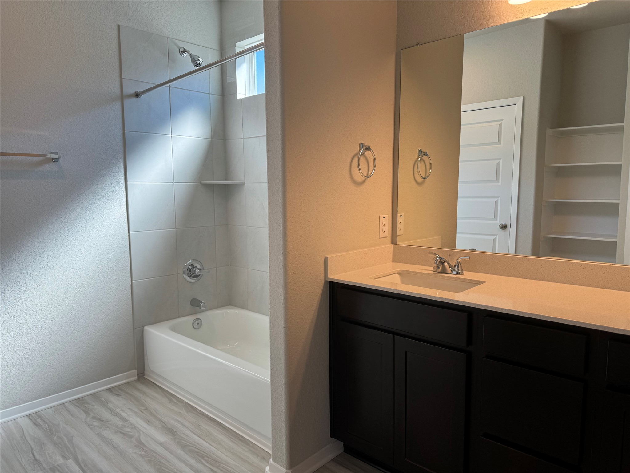 151 Bent Crk Lane Georgetown, TX 78628 - Photo 6 of 17 a bathroom with a tub sink and mirror