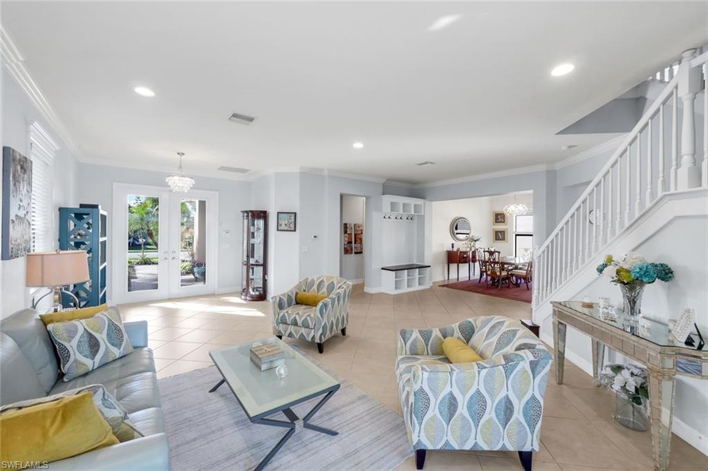 2735 Cinnamon Bay Circle Naples, FL 34119 - Photo 17 of 50 a living room with furniture and wooden floor