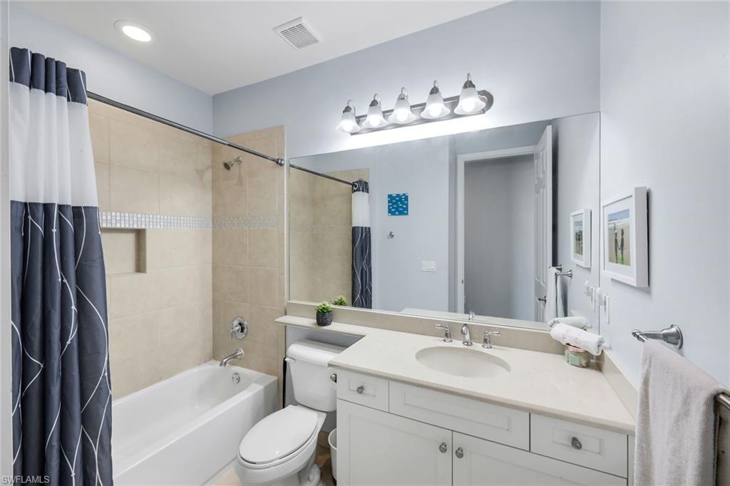2735 Cinnamon Bay Circle Naples, FL 34119 - Photo 29 of 50 a bathroom with a sink toilet tub and shower