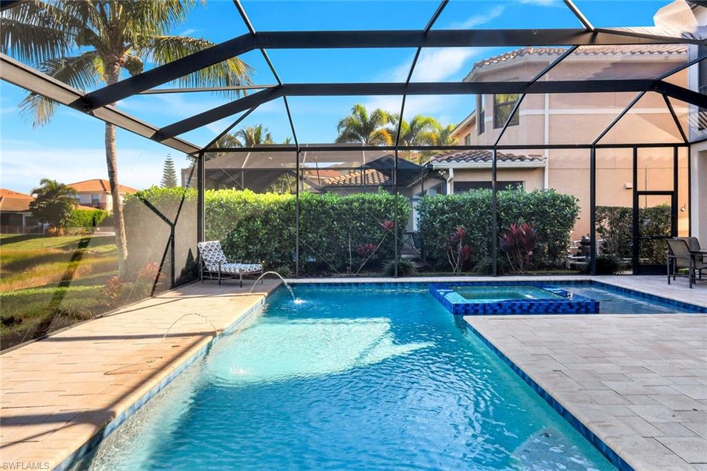 2735 Cinnamon Bay Circle Naples, FL 34119 - Photo 40 of 50 a view of swimming pool with a lounge chairs
