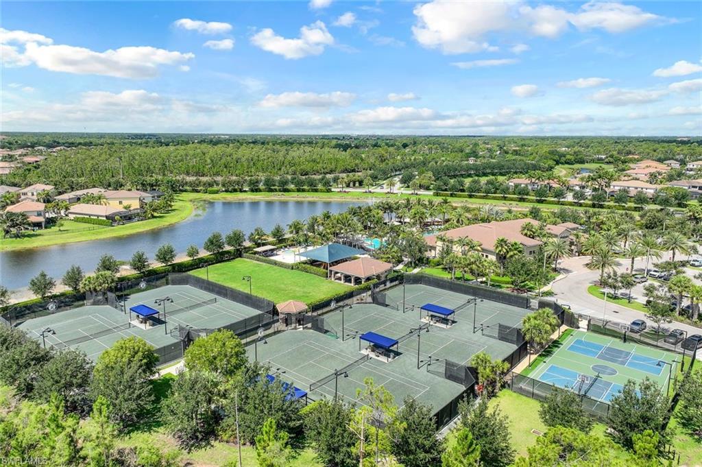 2735 Cinnamon Bay Circle Naples, FL 34119 - Photo 47 of 50 an aerial view of lake residential house with outdoor space and trees around