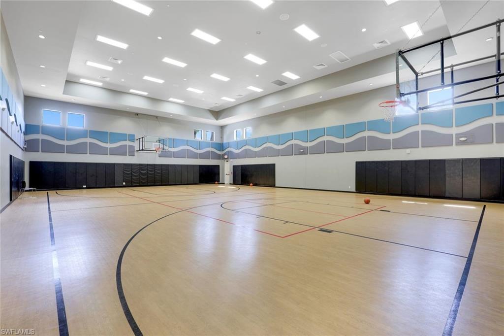 2735 Cinnamon Bay Circle Naples, FL 34119 - Photo 48 of 50 a large hall with stainless steel appliances kitchen island a large island in the center
