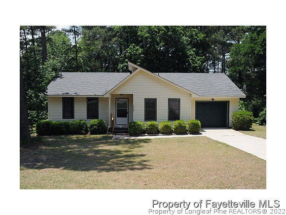 1774 Rim Road Fayetteville, NC 28314 - Photo 1 of 1 a front view of a house with a yard