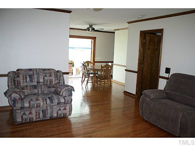 Hardwood flooring leads from the family room into the dining area to complement the look of this spacious area. Den/Family/Great Room