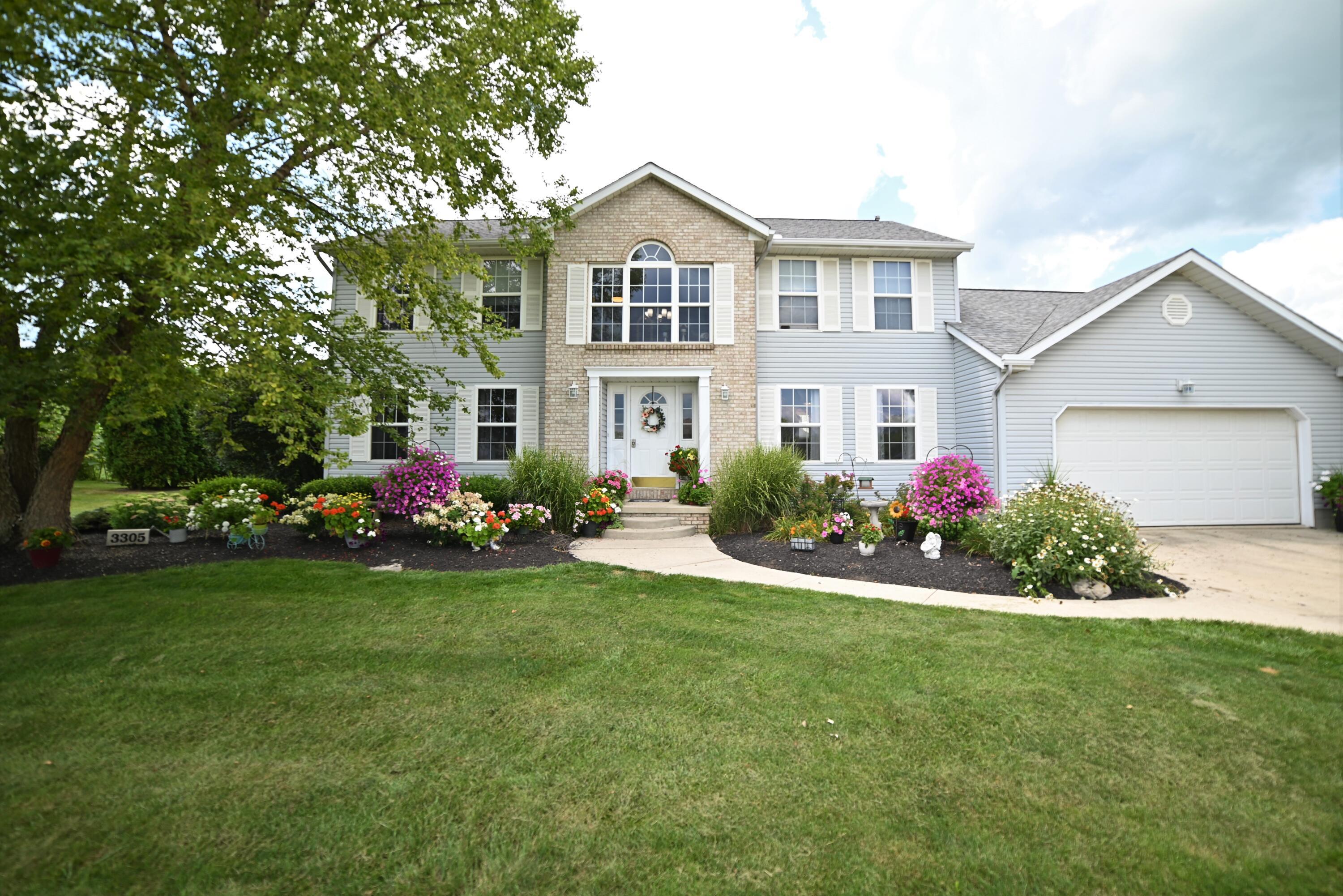 Fantastic country home with two car garage with one electric charging station.