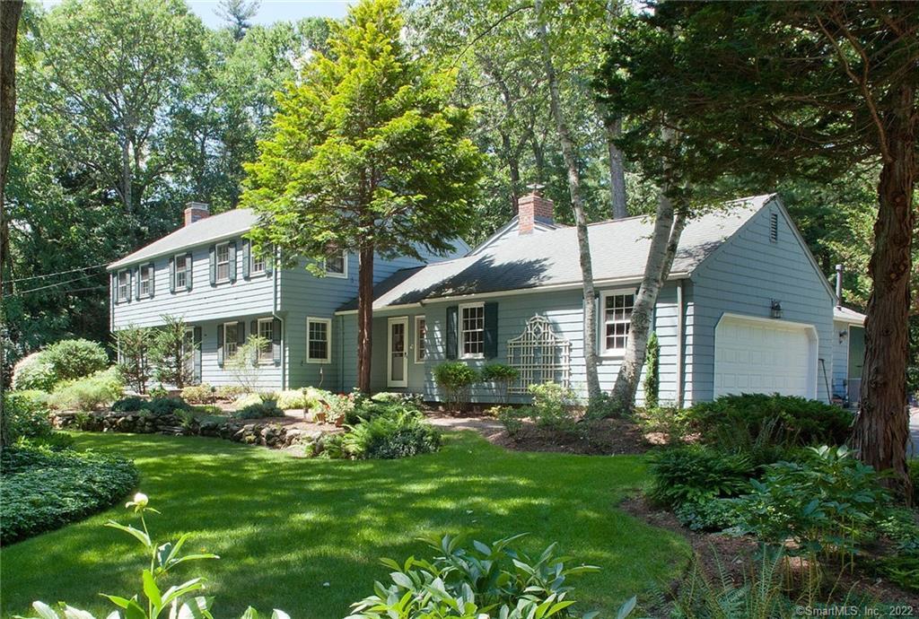 1 Drumlin Road Simsbury, CT 06092 - Photo 1 of 1 a front view of a house with a garden