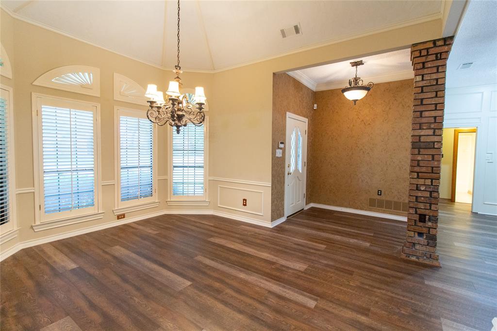 3014 Pecan Ridge Drive Rowlett, TX 75088 - Photo 2 of 29 a view of a big room with wooden floor and chandelier