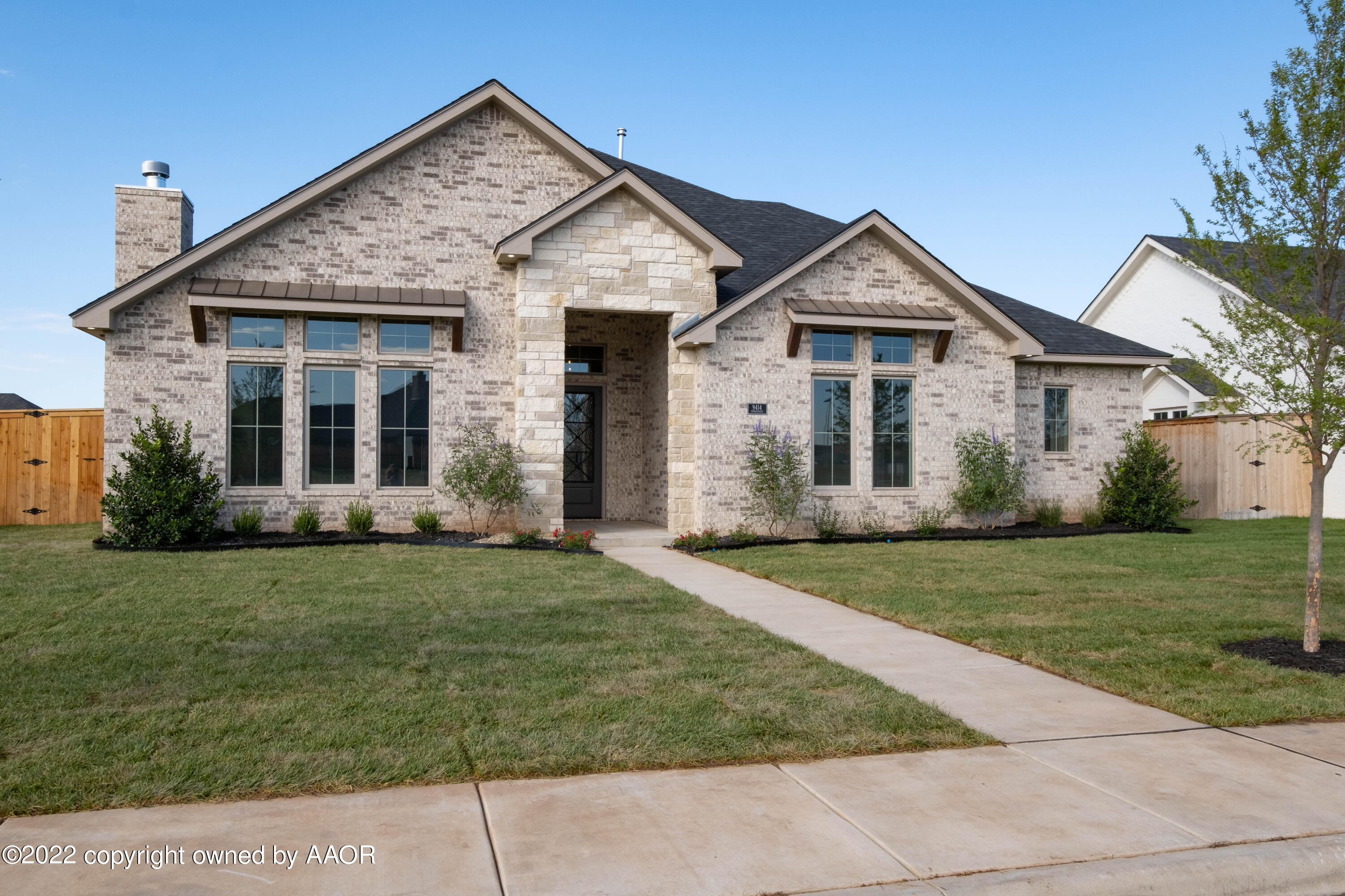9414 Stonecrest Drive Amarillo, TX 79118 - Photo 2 of 60 a front view of a house with a yard