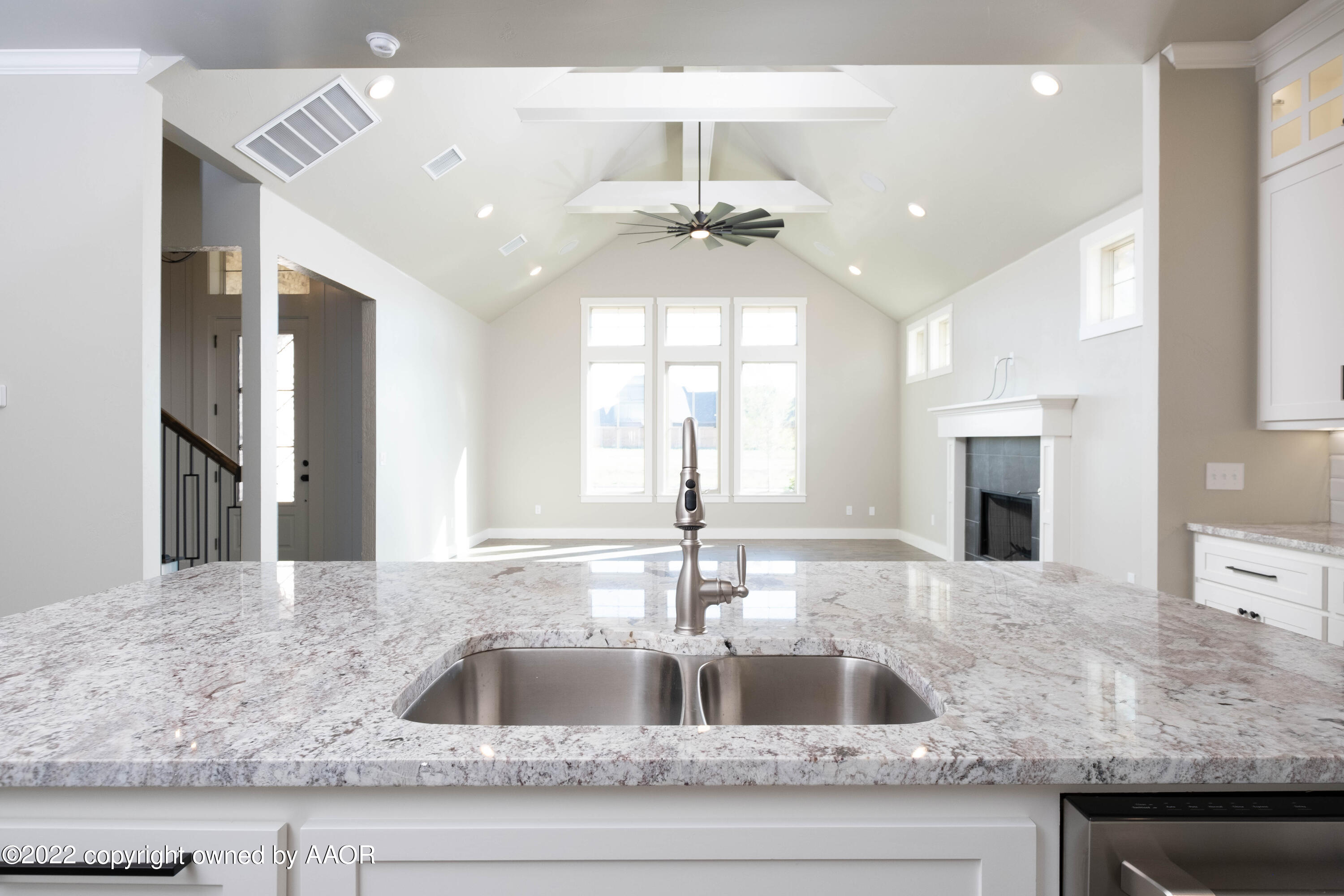 9414 Stonecrest Drive Amarillo, TX 79118 - Photo 21 of 60 a kitchen with granite countertop a sink a counter top space cabinets and stainless steel appliances
