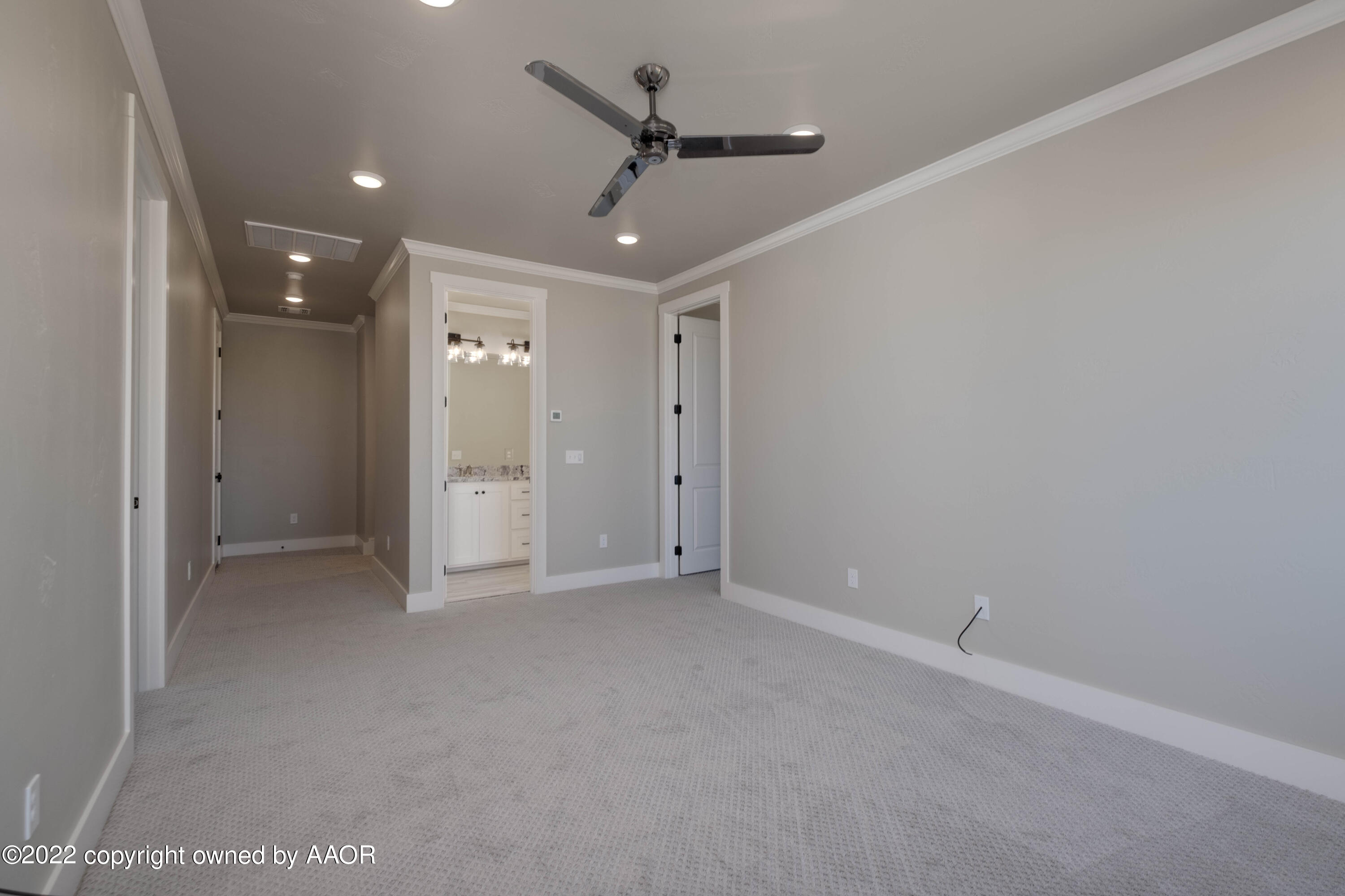 9414 Stonecrest Drive Amarillo, TX 79118 - Photo 40 of 60 an empty room with closet and a ceiling fan