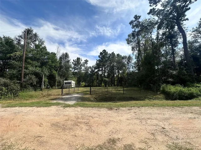 a view of a yard with entertaining space