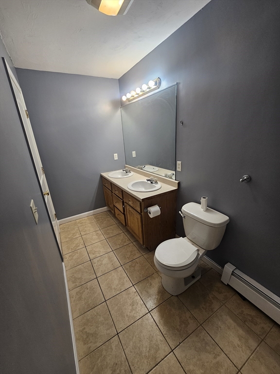 40 Merrick Street, Unit A Worcester, MA 01609 - Photo 20 of 32 a bathroom with a toilet sink and mirror