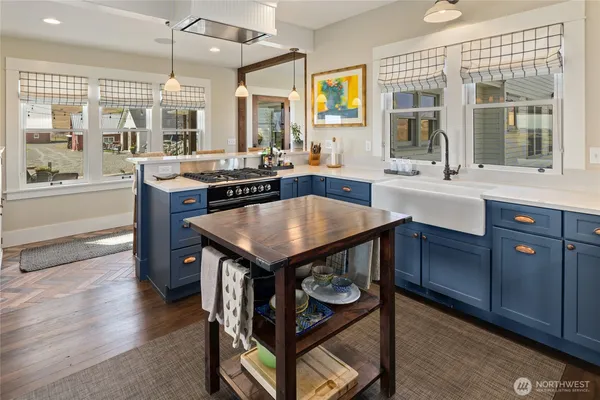 a large kitchen with a table and chairs
