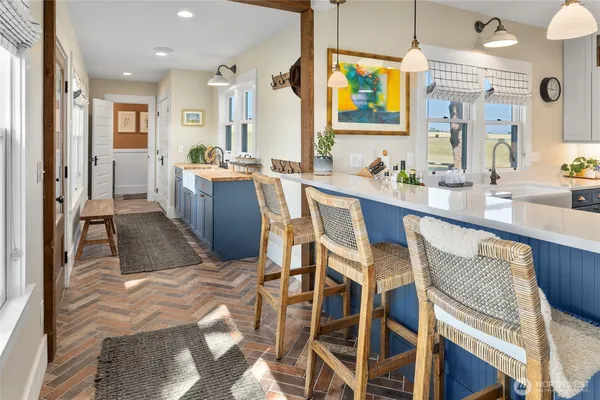 a spacious bathroom with sinks a mirror and shower