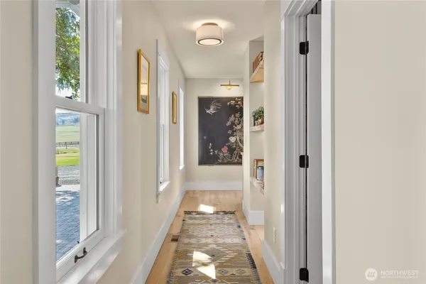 a bathroom with a granite countertop sink and a shower curtain