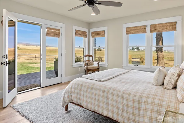 a bedroom with a bed and a lamp