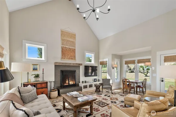 a living room with furniture and a dining table