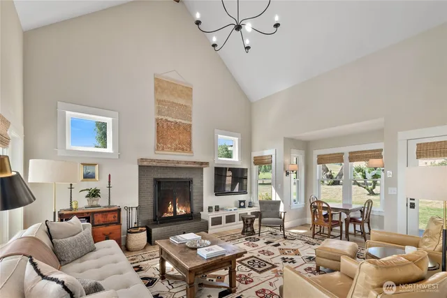 a living room with furniture and a dining table