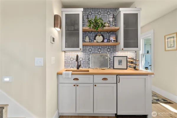 a bedroom with furniture and a wooden floor