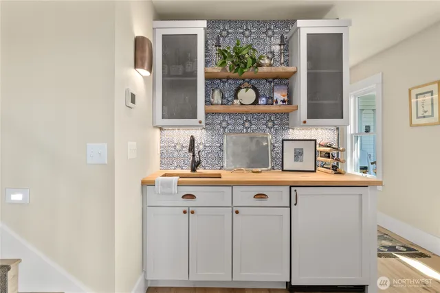 a bedroom with furniture and a wooden floor