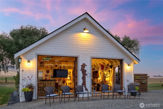 a building outdoor space with patio furniture and potted plants