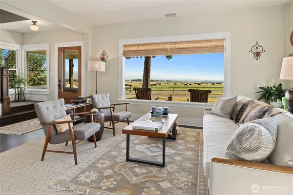 a living room with furniture and a table