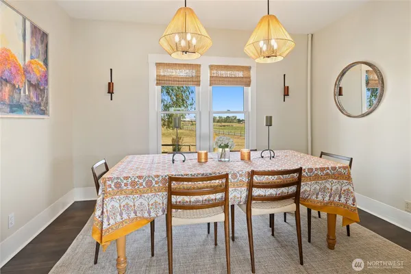a kitchen with a table chairs stove and cabinets