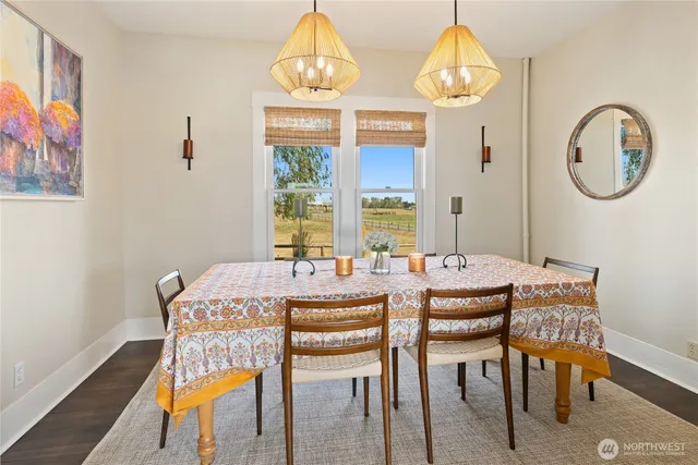 a kitchen with a table chairs stove and cabinets