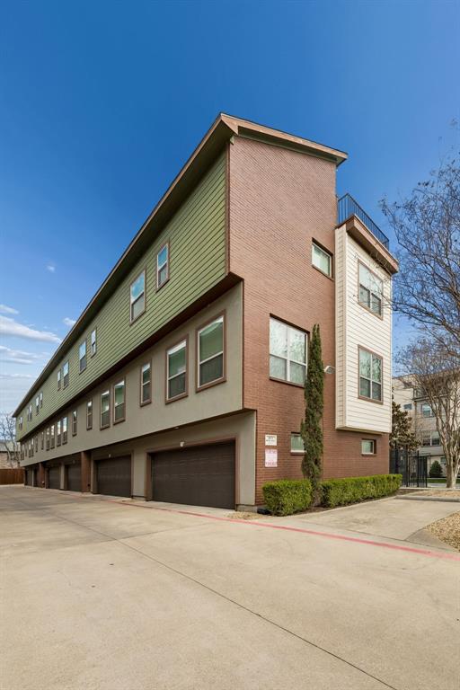 5875 Ross Avenue, Unit 9 Dallas, TX 75206 - Photo 27 of 29 View of property exterior with a garage and brick siding