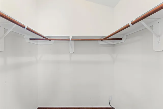 a view of an empty walk in closet