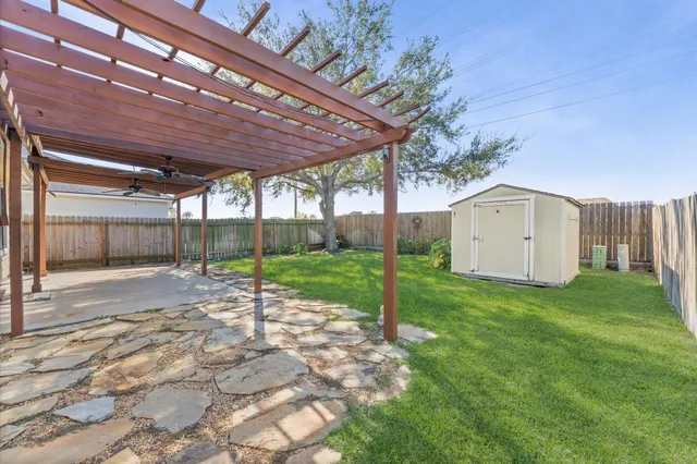 a backyard of a house with a garden and plants