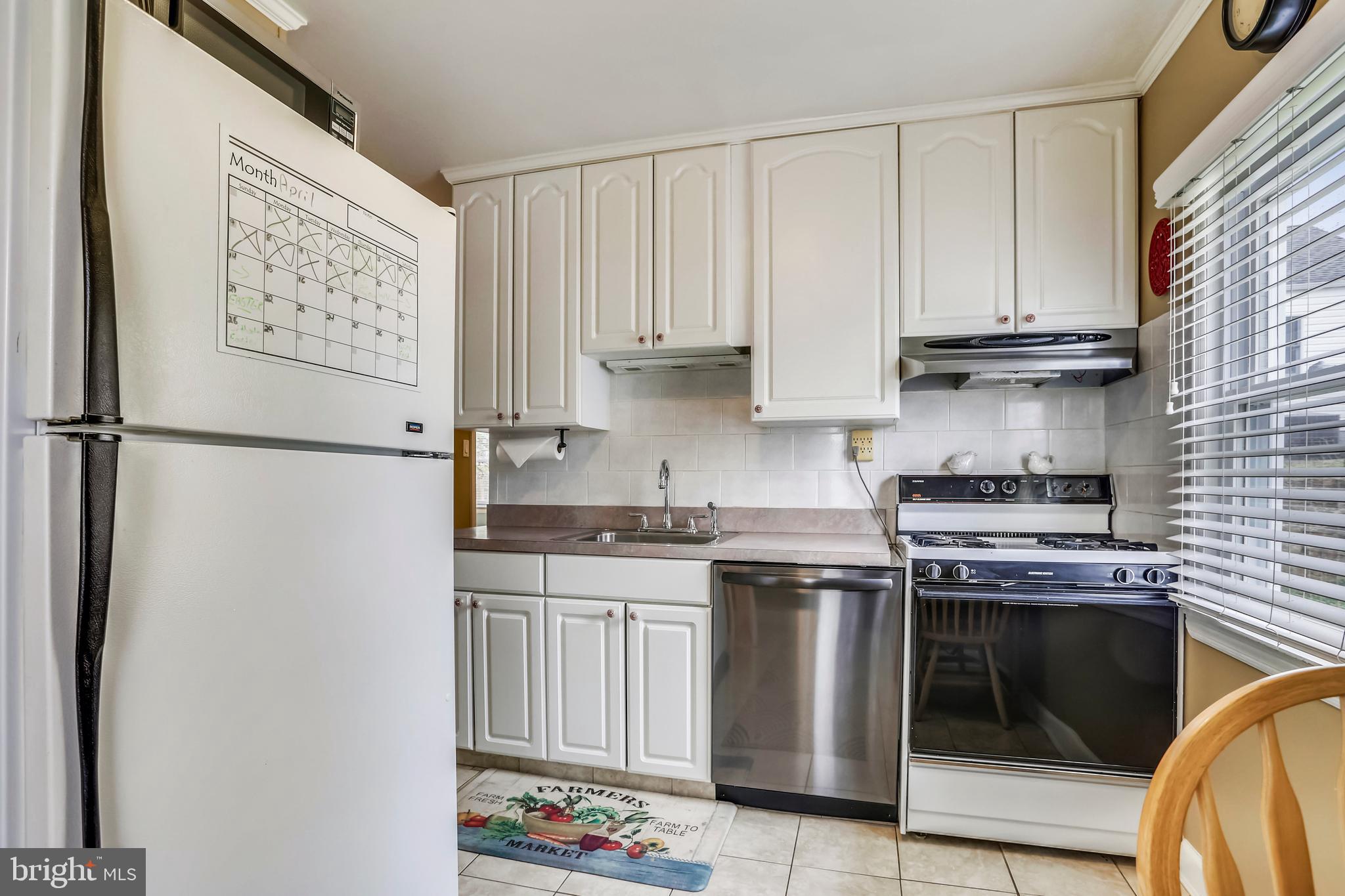 4319 Fernhill Road Silver Spring, MD 20906 - Photo 7 of 29 a kitchen with stainless steel appliances granite countertop a stove a refrigerator and a microwave