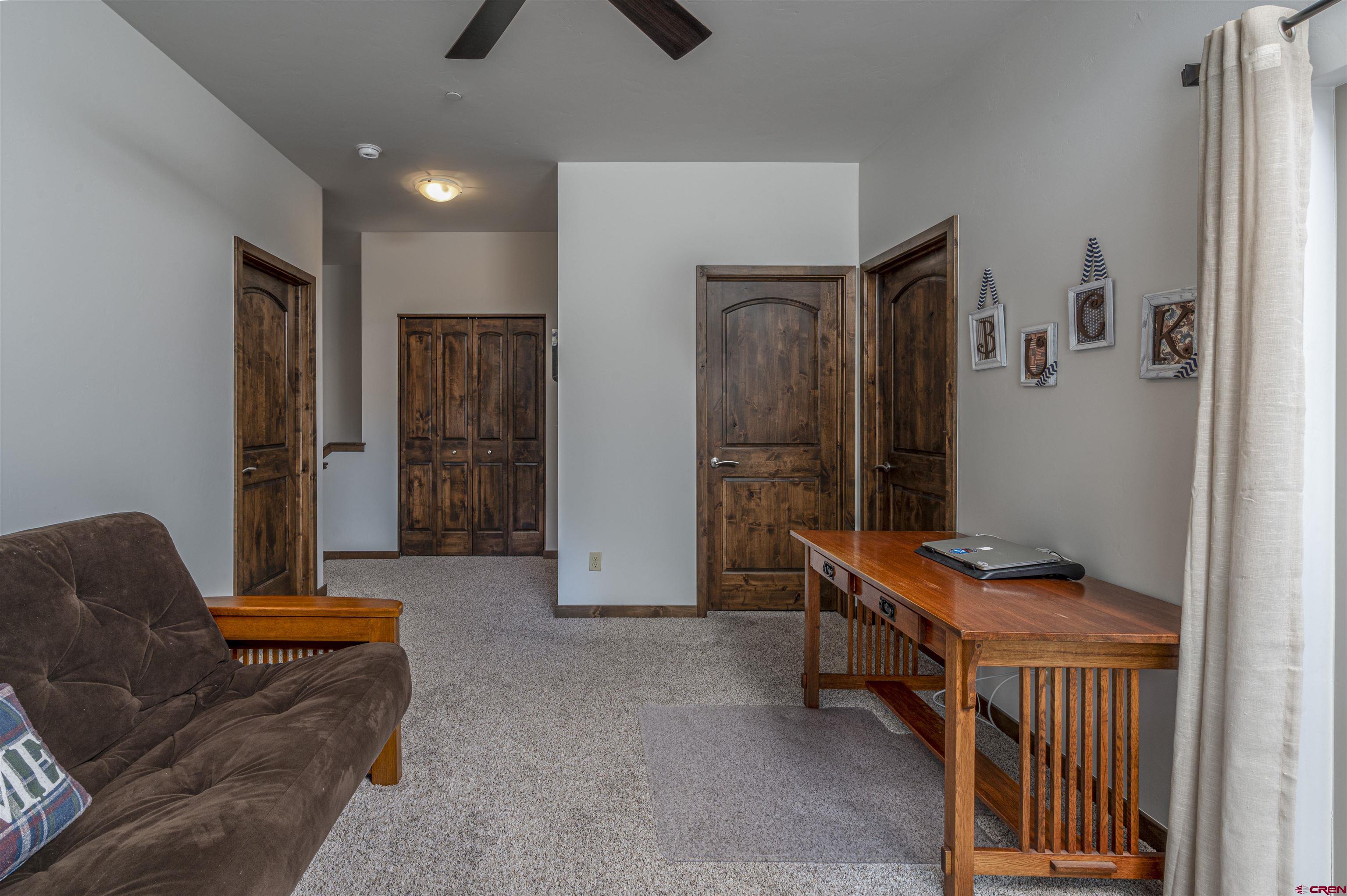 1422 Animas View Drive, Unit 24 Durango, CO 81301 - Photo 14 of 23 a bedroom with furniture and a window