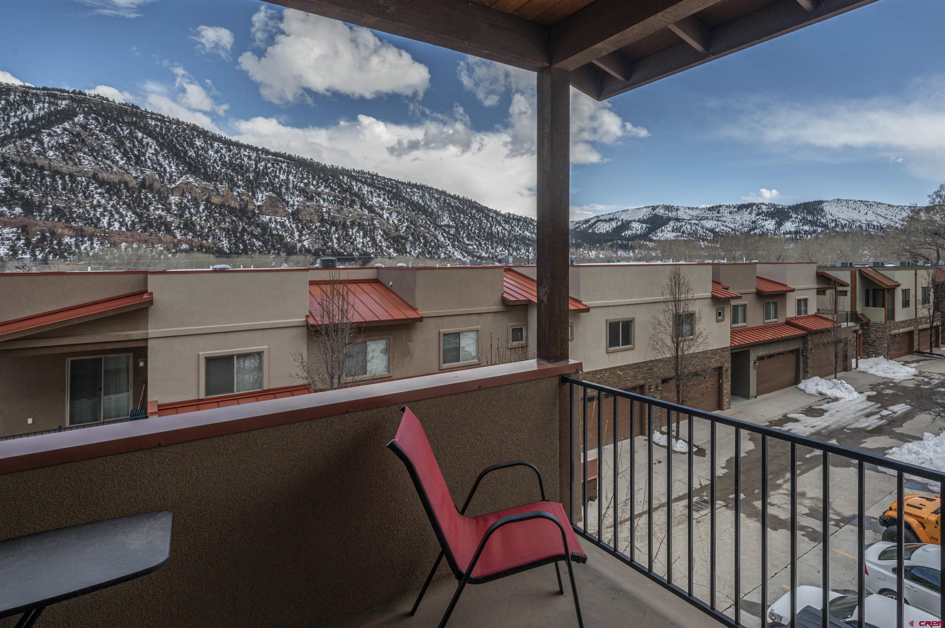1422 Animas View Drive, Unit 24 Durango, CO 81301 - Photo 15 of 23 a view of a chairs and table in the balcony