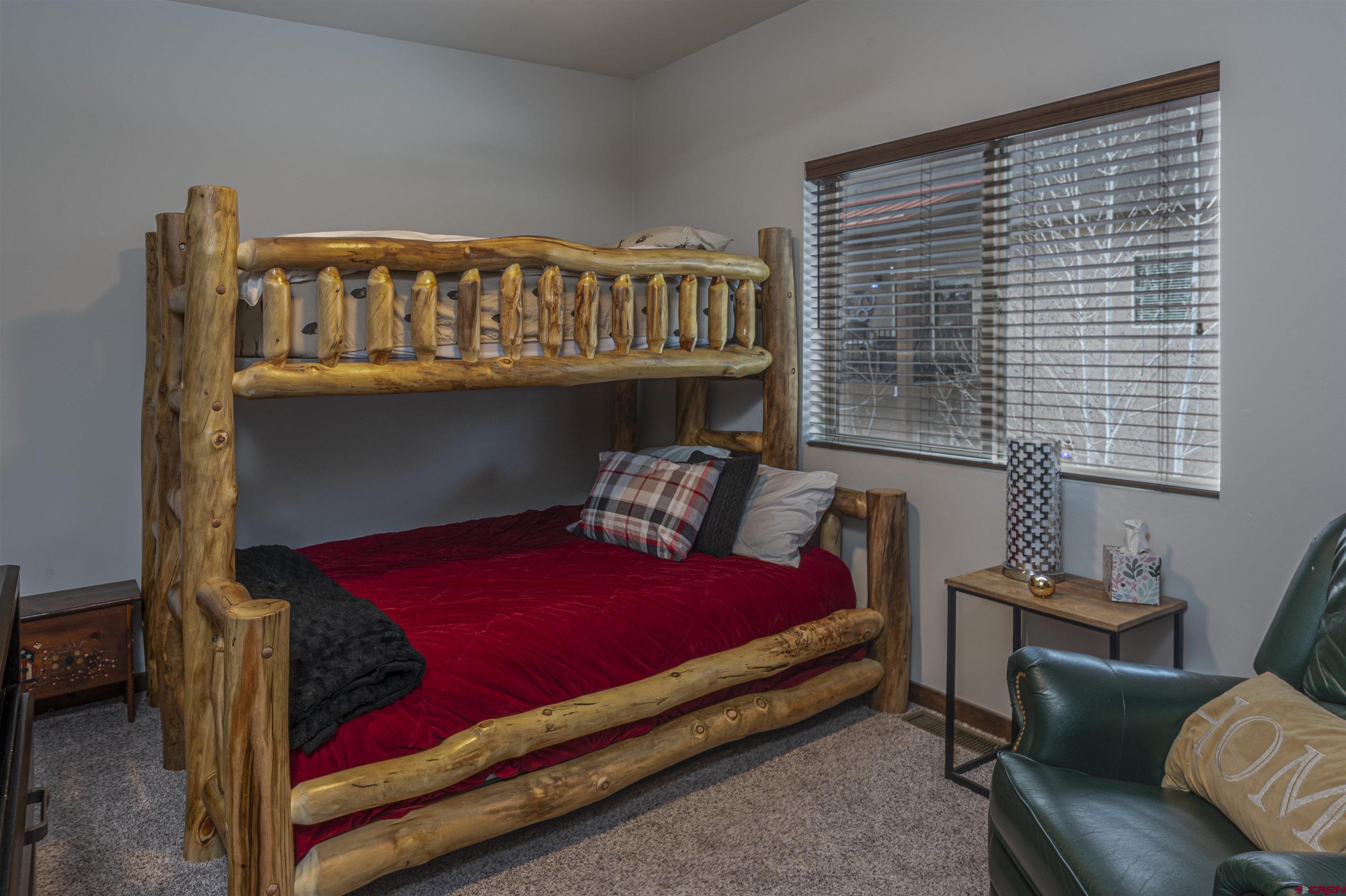 1422 Animas View Drive, Unit 24 Durango, CO 81301 - Photo 16 of 23 a bed room with a bed and a window