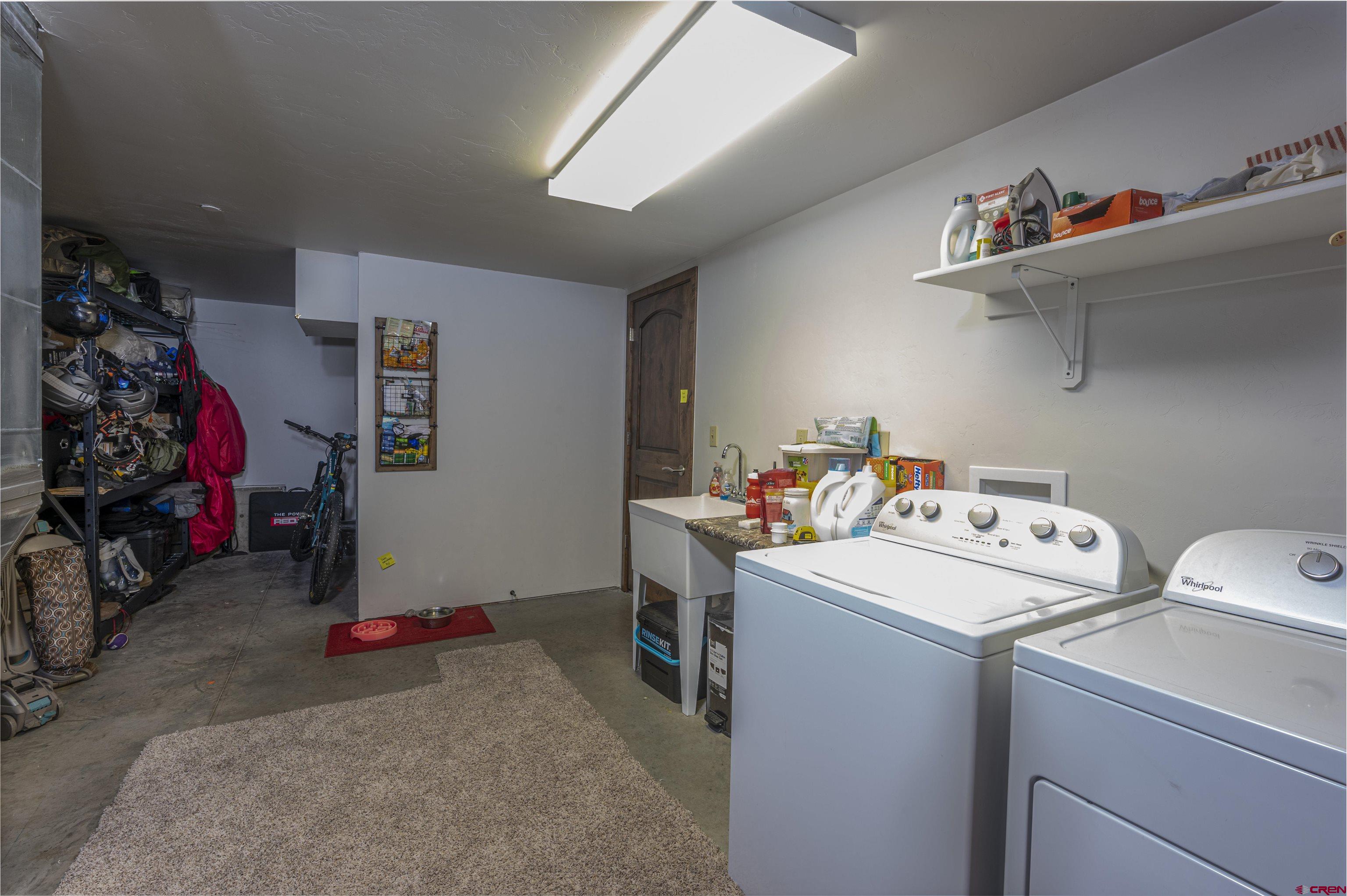 1422 Animas View Drive, Unit 24 Durango, CO 81301 - Photo 20 of 23 a utility room with dryer and washer