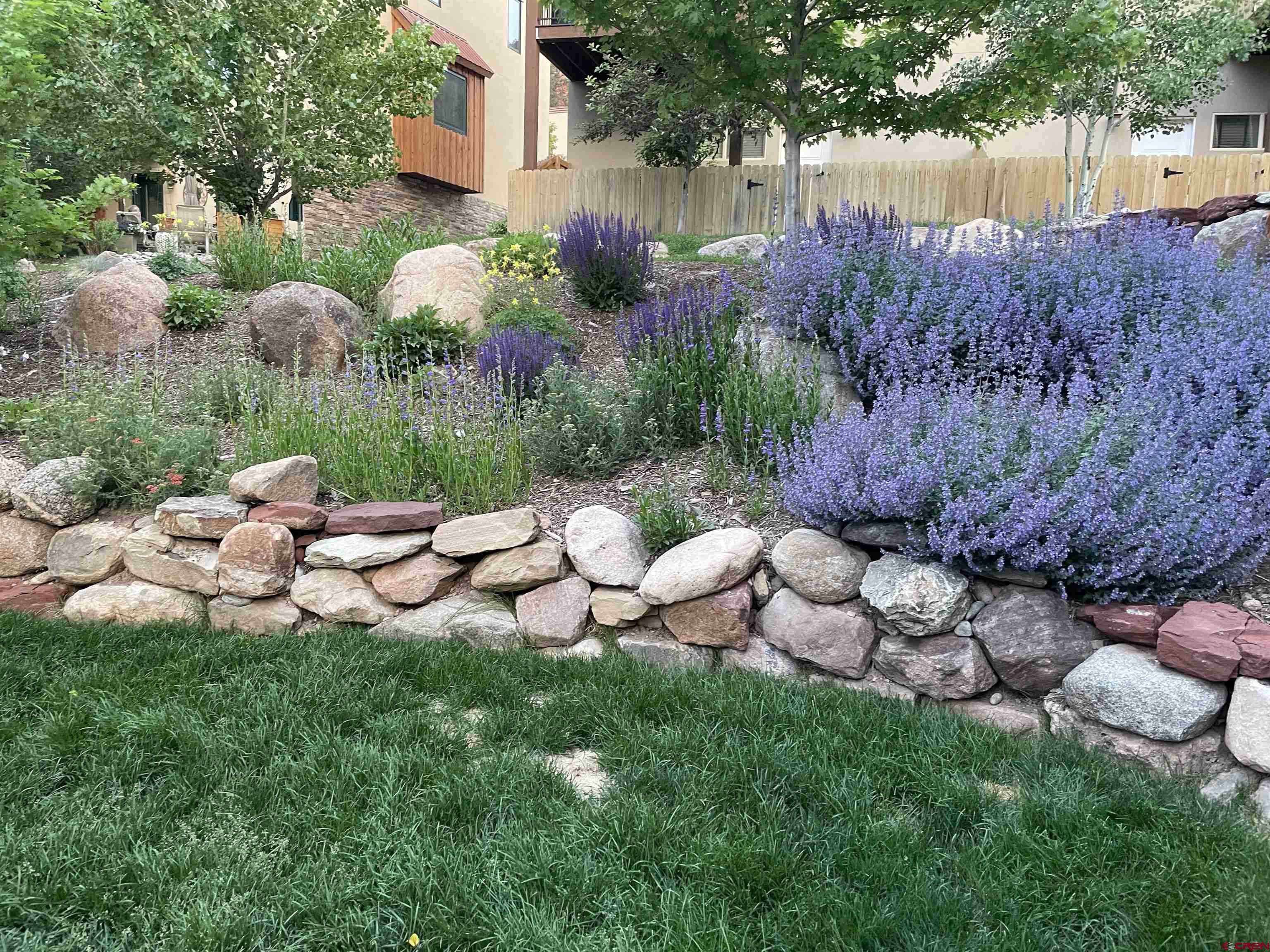 1422 Animas View Drive, Unit 24 Durango, CO 81301 - Photo 2 of 23 a view of a backyard with plants and outdoor seating