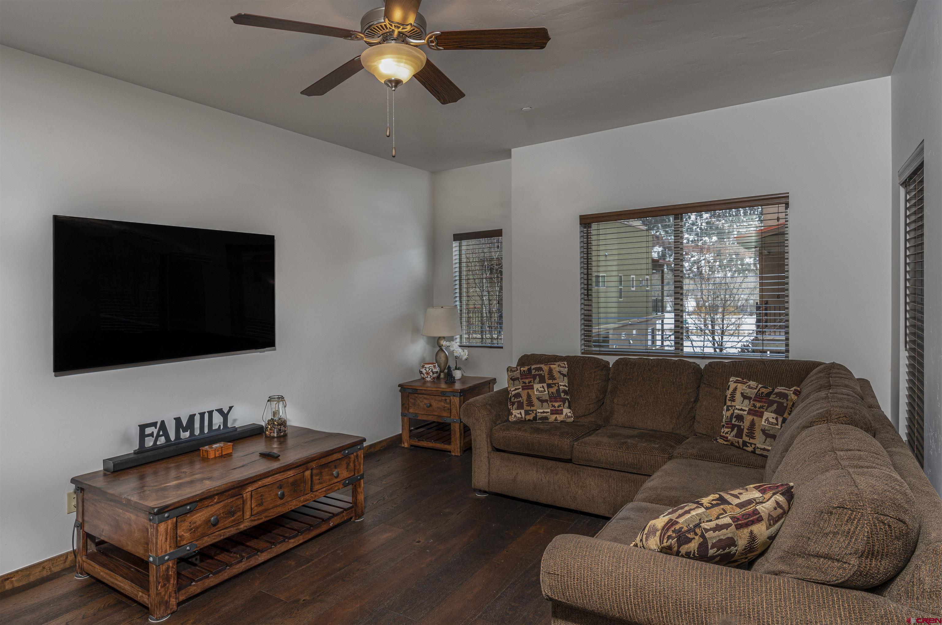 1422 Animas View Drive, Unit 24 Durango, CO 81301 - Photo 6 of 23 a living room with furniture and a flat screen tv