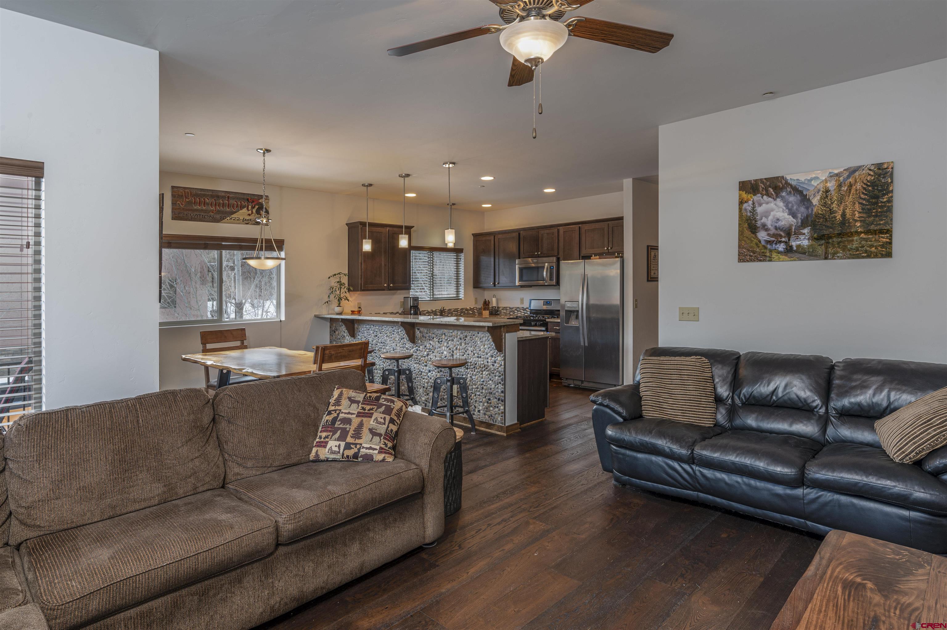 1422 Animas View Drive, Unit 24 Durango, CO 81301 - Photo 7 of 23 a view of a living room kitchen and a wooden floor