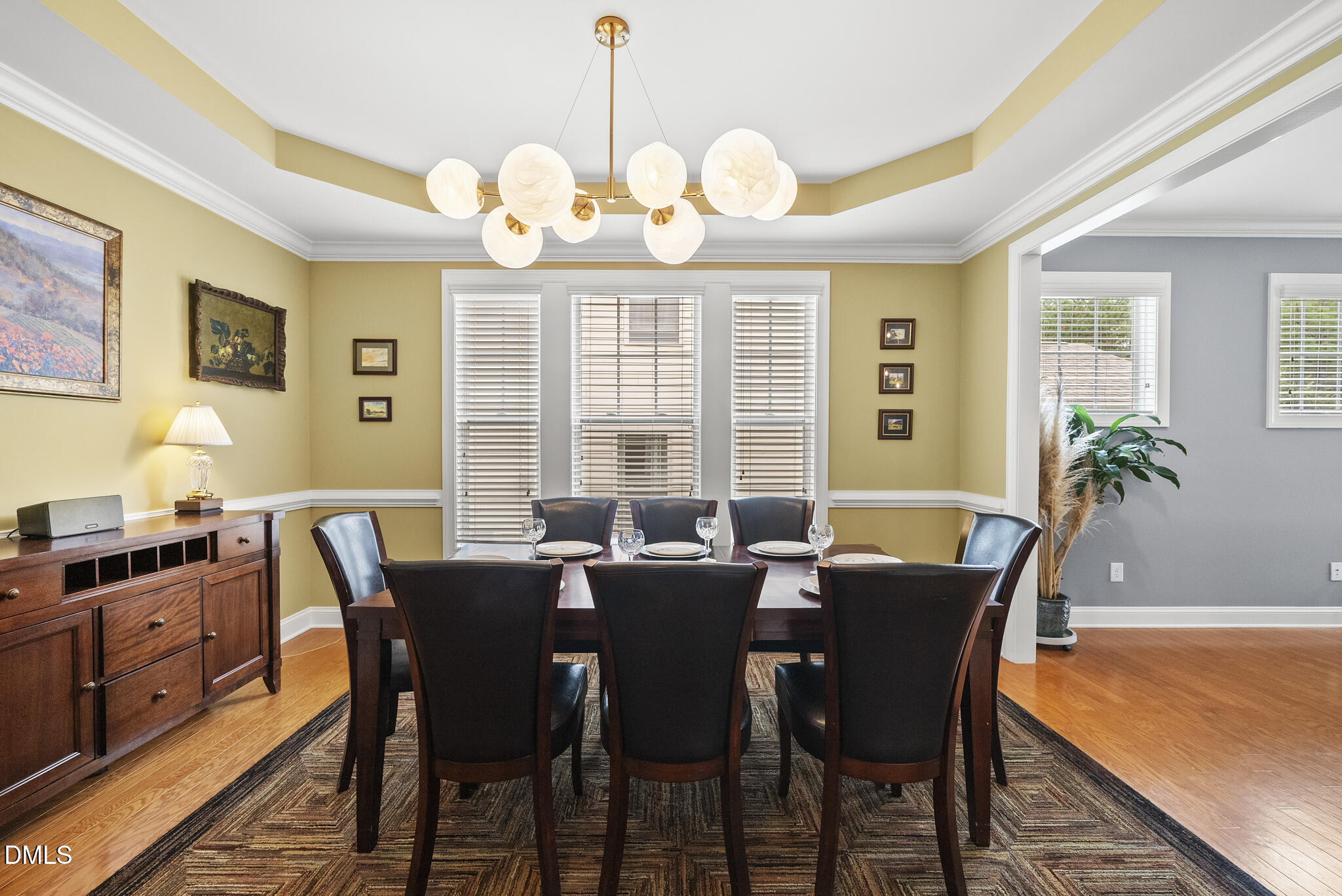 424 Powers Ferry Road Cary, NC 27519 - Photo 11 of 88 a view of a dining room with furniture window and wooden floor