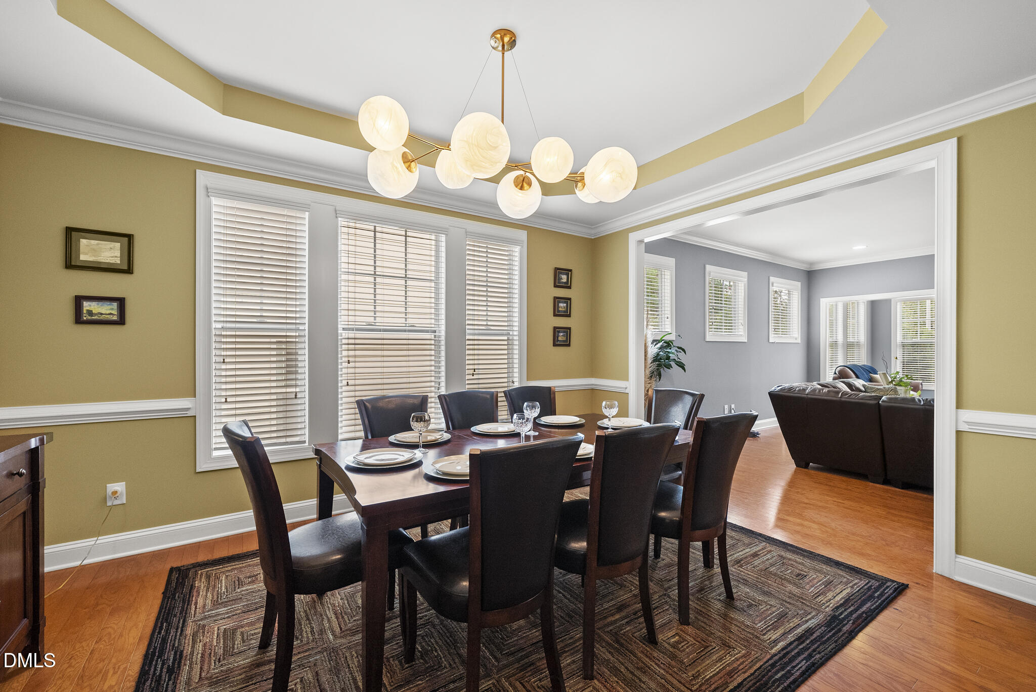 424 Powers Ferry Road Cary, NC 27519 - Photo 12 of 88 a view of a dining room with furniture and wooden floor