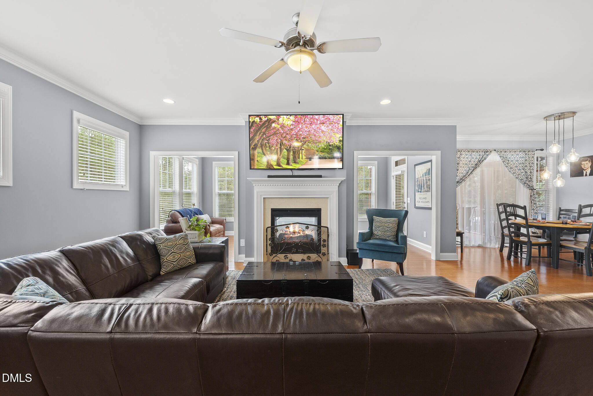 424 Powers Ferry Road Cary, NC 27519 - Photo 15 of 88 a living room with furniture a fireplace and a flat screen tv