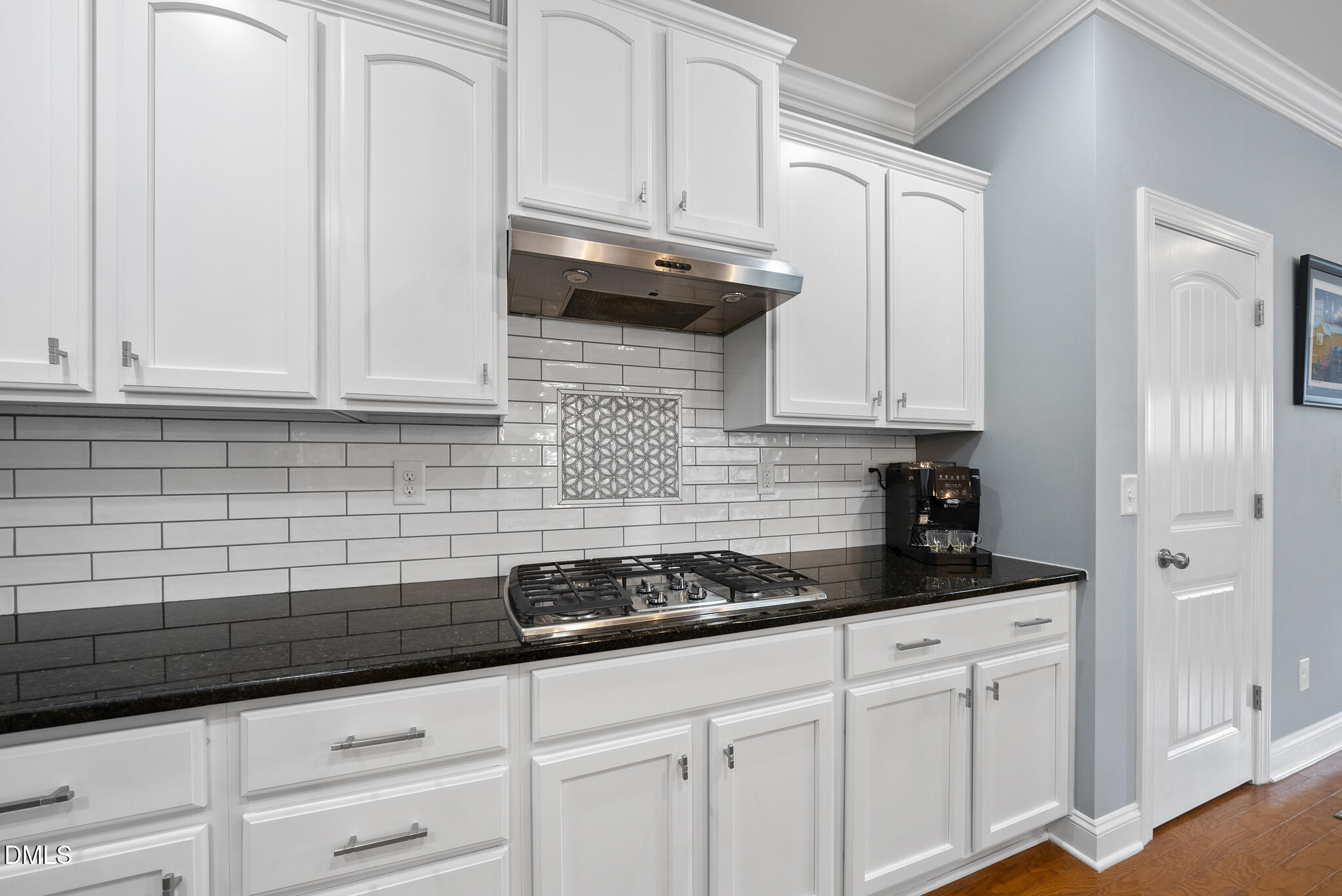 424 Powers Ferry Road Cary, NC 27519 - Photo 22 of 88 a kitchen with granite countertop white cabinets and stainless steel appliances